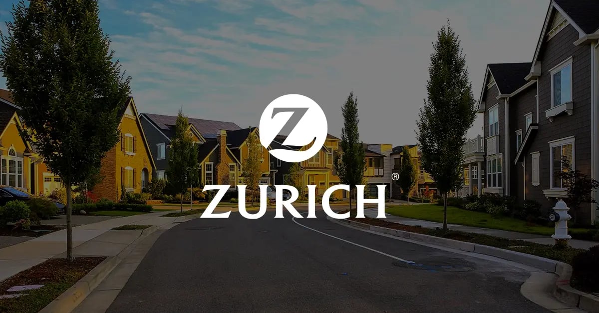 Photo of a residential neighbourhood with a white version of the Zurich logo superimposed in the middle foreground