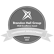 Brandon hall 2023 gold awards badge for leadership development in greyscale